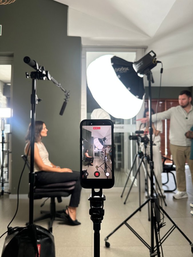 Behind the scenes framing an interview on the phone