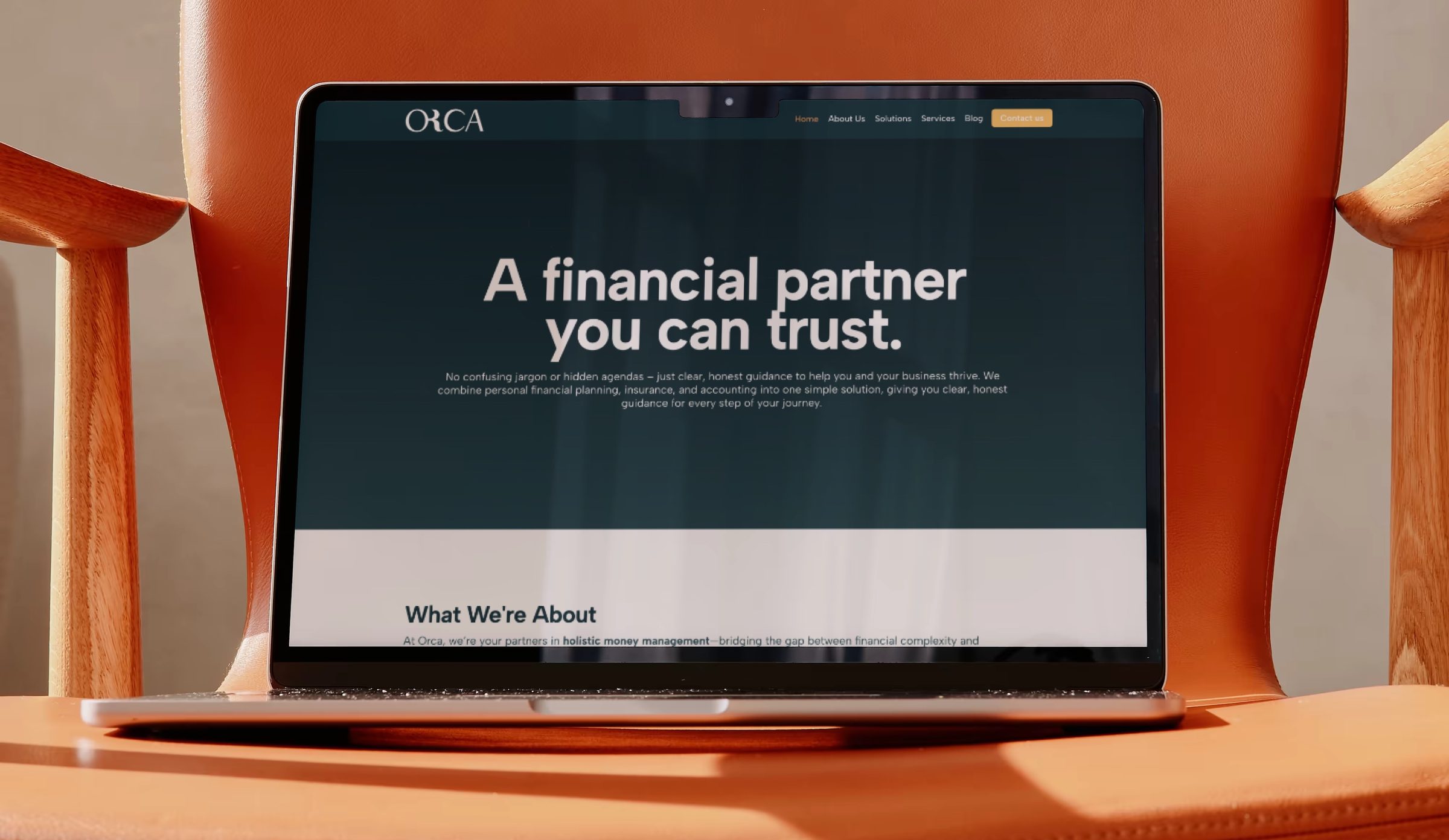 The unified Orca website homepage on a laptop